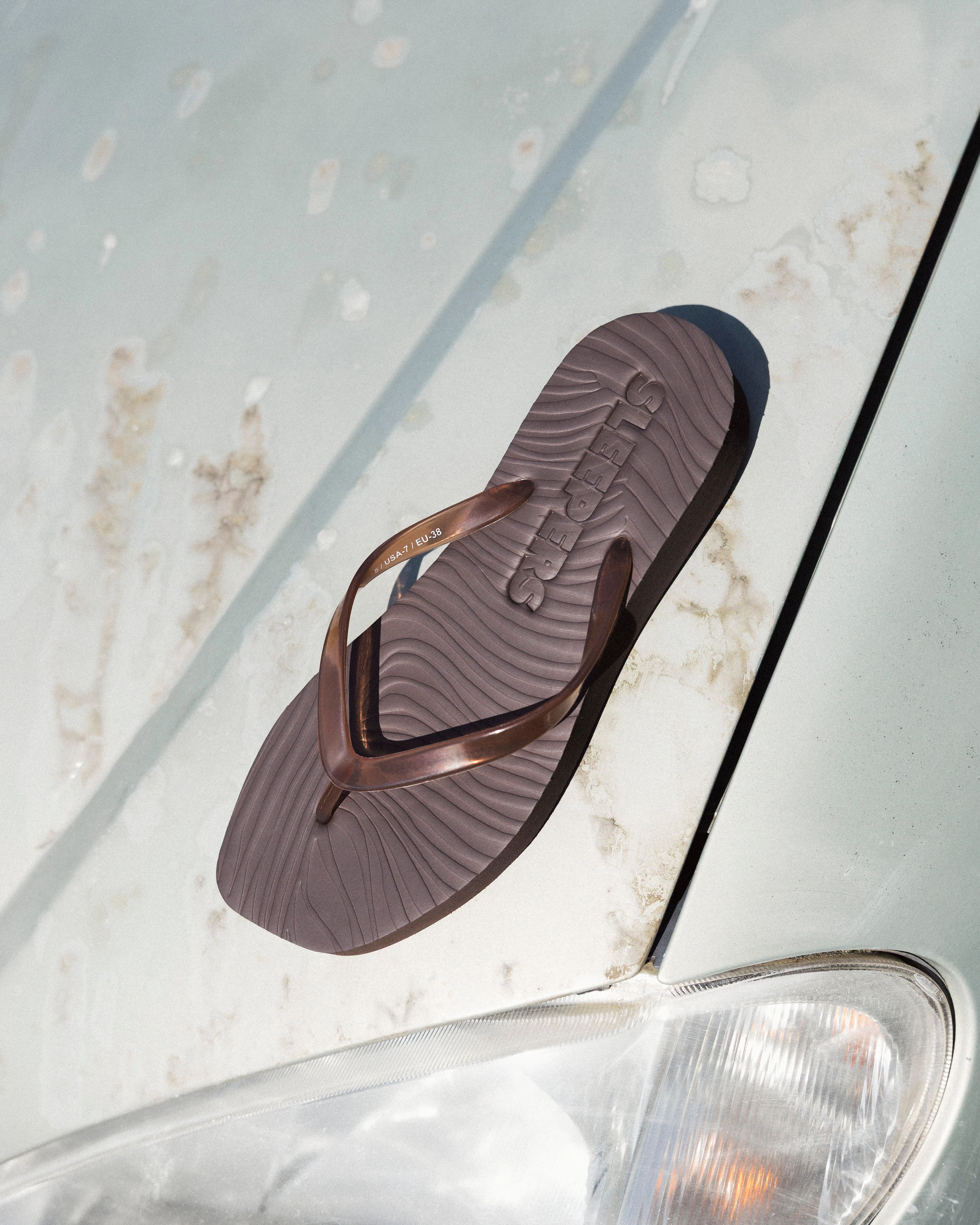 Tapered Platform Transparent Brown Flip Flops With High Arch
